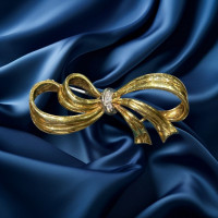 Pre-loved vintage second hand 18ct yellow gold diamond bow brooch